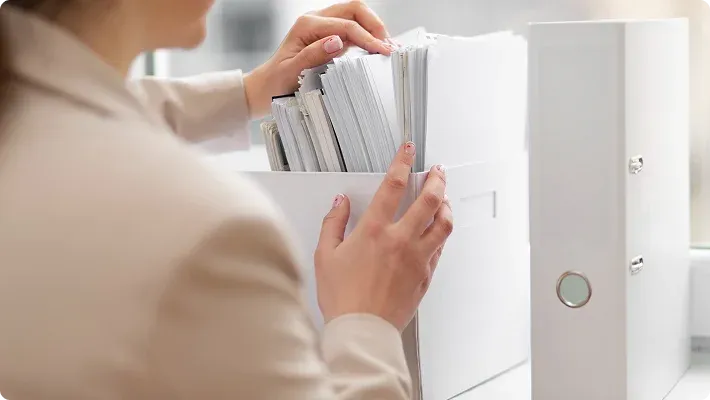 Hands holding documents